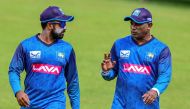 Sri Lanka's interim coach Sanath Jayasuriya (R) and captain Charith Asalanka speak during a practice session ahead of their first Twenty20 cricket match against India at the Pallekele International Cricket Stadium in Kandy on July 25, 2024. (Photo by Ishara S. KODIKARA / AFP)