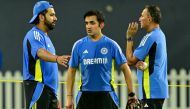 India's captain Rohit Sharma talks with head coach Gautam Gambhir (C) and chief selector Ajit Agarkar (R) during a practice session in Colombo on July 31, 2024. (Photo by Ishara S. Kodikara / AFP)
 