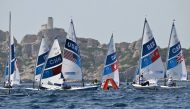 US' Erika Reineke and Britain's Hannah Snellgrove (R) compete in Race 4 of the women’s ILCA 6 single-handed dinghy event during the Paris 2024 Olympic Games sailing competition at the Roucas-Blanc Marina in Marseille on August 2, 2024. Photo by NICOLAS TUCAT / AFP.