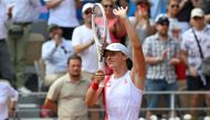 Poland's Iga Swiatek celebrates after beatinng Slovakia's Anna Karolina Schmiedlova in their women's singles Bronze Medal tennis match on Court Philippe-Chatrier at the Roland-Garros Stadium during the Paris 2024 Olympic Games, in Paris on August 2, 2024. (Photo by Miguel Medina / AFP)