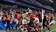  Egypt's players celebrate their victory in the men's quarter-final football match between Egypt and Paraguay during the Paris 2024 Olympic Games at the Marseille Stadium in Marseille on August 2, 2024. (Photo by Pascal GUYOT / AFP)
