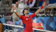 Serbia's Novak Djokovic celebrates beating Italy's Lorenzo Musetti during their men's singles semi-final tennis match on Court Philippe-Chatrier at the Roland-Garros Stadium during the Paris 2024 Olympic Games, in Paris on August 2, 2024. (Photo by CARL DE SOUZA / AFP)