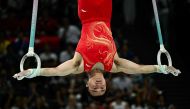 China's Liu Yang competes in the artistic gymnastics men's rings final during the Paris 2024 Olympic Games at the Bercy Arena in Paris, on August 4, 2024. (Photo by Loic VENANCE / AFP)
