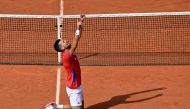 Serbia's Novak Djokovic reacts to beating Spain's Carlos Alcaraz in their men's singles final tennis match on Court Philippe-Chatrier at the Roland-Garros Stadium during the Paris 2024 Olympic Games, in Paris on August 4, 2024. (Photo by Miguel MEDINA / AFP)
