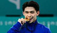 Philippines' Carlos Edriel Yulo (gold) poses during the podium ceremony for the artistic gymnastics men's vault event of the Paris 2024 Olympic Games at the Bercy Arena in Paris, on August 4, 2024. (Photo by Loic VENANCE / AFP)
