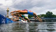 File: Athletes compete in the swimming race in the Seine during the women's individual triathlon at the Paris 2024 Olympic Games in central Paris on July 31, 2024. (Photo by Martin Bureau / POOL / AFP)
