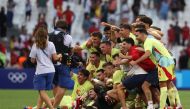 Spain's players celebrate their victory over Morroco at the end of the men's semi-final football match between Morocco and Spain of the Paris 2024 Olympic Games at the Marseille Stadium in Marseille on August 5, 2024. (Photo by Pascal GUYOT / AFP)
