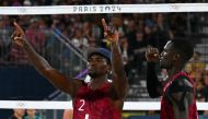 Qatar’s Ahmed Tijan (left) and Cherif Younousse celebrate after scoring a point against USA. AFP