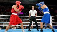 Thailand's Janjaem Suwannapheng and Algeria's Imane Khelif (Blue) compete in the women's 66kg semi-final boxing match during the Paris 2024 Olympic Games at the Roland-Garros Stadium, in Paris on August 6, 2024. Photo by MOHD RASFAN / AFP.