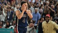 USA's #04 Stephen Curry celebrates scoring a three-point field goal in the men's Gold Medal basketball match between France and USA during the Paris 2024 Olympic Games at the Bercy Arena in Paris on August 10, 2024. (Photo by Damien MEYER / AFP)
