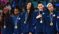 Gold medallists (From L) USA's #07 Kahleah Copper, USA's #08 Chelsea Gray, USA's #09 A'ja Wilson, USA's #10 Breanna Stewart and USA's #11 Napheesa Collier pose with their medal on the podium after the women's Gold Medal basketball match between France and the USA during the Paris 2024 Olympic Games at the Bercy Arena in Paris on August 11, 2024. (Photo by Aris MESSINIS / AFP)
