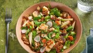 Halloumi salad with almond crunch and tahini dressing. (Photo by Rey Lopez for The Washington Post; food styling by Lisa Cherkasky for The Washington Post)

