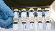 (FILES) This file photo taken on August 9, 2022 shows vials of the JYNNEOS Monkeypox vaccine are prepared at a pop-up vaccination clinic in Los Angeles, California. (Photo by Patrick T. FALLON / AFP)
