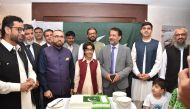 Ambassador of Pakistan H E Muhammad Aejaz (third right) with officials and guests during cake cutting ceremony to mark Independence Day of Pakistan in Doha.