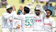 Bangladesh’s Mehidy Hasan Miraz (centre) celebrates with teammates after taking the wicket of Pakistan’s Mohammad Rizwan yesterday. 