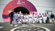 French President of the Paris 2024 Olympics and Paralympics Organising Committee (COJO) Tony Estanguet (L) poses with torchbearers of the Paris 2024 Paralympic Games during a ceremony for the arrival of the Paralympics flame at the entrance of the Channel Tunnel in Coquelles, northern France, on August 25, 2024. Photo by Lou Benoist / AFP.