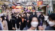 People walk along a commercial street in Seoul, S Korea. (AFP)