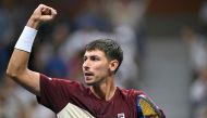 Australia's Alexei Popyrin celebrates after winning a game against Serbia's Novak Djokovic during their men's singles third round match on day five of the US Open tennis tournament at the USTA Billie Jean King National Tennis Center in New York City, on August 30, 2024. (Photo by ANGELA WEISS / AFP)