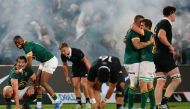 South Africa's loose forward Eben Etzebeth (L) and South Africa's full-back Aphelele Fassi (2nd L) celebrate after South Africa won the Rugby Championship Test match between South Africa and New Zealand at the Ellis Park Stadium in Johannesburg on August 31, 2024. (Photo by PHILL MAGAKOE / AFP)
