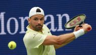 Bulgaria's Grigor Dimitrov plays a return to Russia's Andrey Rublev during their men's singles round of 16 match on day seven of the US Open tennis tournament at the USTA Billie Jean King National Tennis Center in New York City, on September 1, 2024. (Photo by TIMOTHY A. CLARY / AFP)
