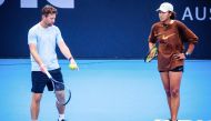 (Files) Japan's Naomi Osaka (R) and coach Wim Fissette attend a training session ahead of the Brisbane International tennis tournament at Pat Rafter Arena in Brisbane on December 27, 2023.  (Photo by Patrick HAMILTON / AFP) 