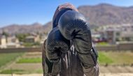 In this photograph taken on July 7, 2024, an Afghan female boxer poses during a training session in Kabul. (Photo by AFP) 

