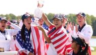 Allisen Corpuz and Rose Zhang of Team United States react after Team United States wins the Solheim Cup during the Sunday Singles matches during the final round of the Solheim Cup 2024 at Robert Trent Jones Golf Club on September 15, 2024 in Gainesville, Virginia. (Photo by Gregory Shamus/Getty Images via AFP)