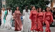 Models present creations during a catwalk presentation for the Edeline Lee Spring/Summer 2025 collection, at London Fashion Week in London, on September 16, 2024. (Photo by BENJAMIN CREMEL / AFP)