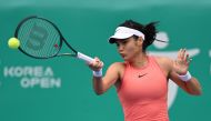 Britain's Emma Raducanu hits a return to Russia's Daria Kasatkina during their women's singles quarter-finals match at the Korea Open tennis championships in Seoul on September 21, 2024. (Photo by Jung Yeon-je / AFP)
 