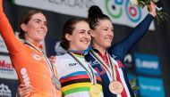 Gold medallist Australia's Grace Brown (C), silver medallist Netherlands' Demi Vollering (L) and bronze medallist (R) US' Chloe Dygert pose on the podium of the women's Elite Individual Time Trial cycling event, 29,9km from Gossau to Zurich, during the UCI 2024 Road World Championships, near Meilen, on September 22, 2024. (Photo by Alex WHITEHEAD / POOL / AFP)
