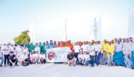 Participants take a group photo during World Cleanup Day event organised by Al Meera.