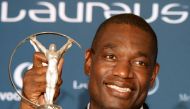 (FILES) Former US basketball star Dikembe Mutombo poses with his 