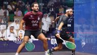 Qatar’s Abdullah Al Tamimi (right) plays a backhand shot against Egypt’s Karim Abdel Gawad during their match yesterday. 