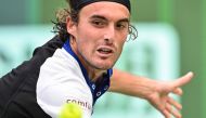 Greece's Stefanos Tsitsipas hits a return to Japan's Kei Nishikori during their men's singles match at the Shanghai Masters tennis tournament in Shanghai on October 4, 2024. (Photo by Hector RETAMAL / AFP)