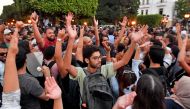 Tunisians shout slogans against President Kais Saied during a demonstration on October 4 2024, in Tunis. (Photo by Fethi Belaid / AFP)