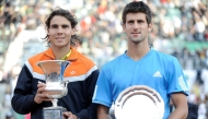 Rafael Nadal of Spain (L) and Novak Djokovic of Serbia pose with their trophies after their final match of the ATP Tennis Open match in Rome on May 3, 2009. Photo by Filippo MONTEFORTE / AFP