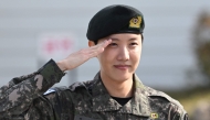 BTS member J-hope salutes after being discharged from his mandatory military service outside a military base in Wonju on October 17, 2024. Photo by JUNG YEON-JE / AFP