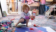 Laurent Schwarz, three years old, creates an artwork in his studio in his parents' house in Neubeuern near Rosenheim, southern Germany on October 17, 2024. (Photo by Michaela Stache / AFP)