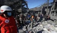 Rescuers search for survivors under the rubble a day after an Israeli airstrike in Beirut's southern suburb of Jnah on October 22, 2024. Photo by IBRAHIM AMRO / AFP.