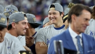 Shohei Ohtani #17 of the Los Angeles Dodgers watches the trophy presentation after the Dodgers defeated the New York Mets on October 20, 2024 in Los Angeles, California. Sean M. Haffey/Getty Images/AFP 