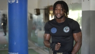 World Kickboxing Champion Mouhamed Tafsir Ba pauses during a training session at the sports hall of the Abdou Diass police camp on October 13, 2024. (Photo by Seyllou / AFP)