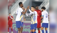 Al Gharafa's Mohammed Muntari (left) celebrates with teammates after scoring the equaliser against Al Duhail.