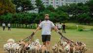 Mitchell Rudy during his Guinness World Record dog-walking feat last month in South Korea. Photo credit: Bonk