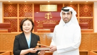 CEO of QICDRC  Faisal Rashid Al Sahouti and President of the Shanghai Financial Court Judge Zhao Hong.