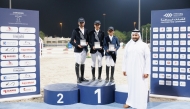 The podium winners of the Amateur class pose for a photograph with QEF’s Director of Support Services Sector Omar Al Buainain.