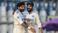 India's Virat Kohli talks with his teammate Ravindra Jadeja (L) during the second day of the third and final Test cricket match between India and New Zealand at Wankhede Stadium in Mumbai on November 2, 2024. (Photo by INDRANIL MUKHERJEE / AFP) / -- IMAGE RESTRICTED TO EDITORIAL USE - STRICTLY NO COMMERCIAL USE --
