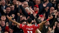 Liverpool's Egyptian striker #11 Mohamed Salah celebrates scoring the team's second goal during the English Premier League football match between Liverpool and Brighton and Hove Albion at Anfield in Liverpool, north west England on November 2, 2024. (Photo by Darren Staples / AFP)