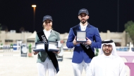 Director of the First Equestrian Team Fahad Rashid Al Amri poses for a photograph with the Big Tour podium winners Cyrine Cherif and Khalid Mohammed Al Emadi. 