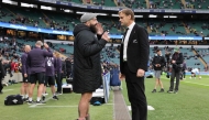 England's Joe Marler (L) speaks with New Zealand's head coach Scott Robertson (R) beside the pitch ahead of the Autumn Nations Series International rugby union test match between England and New Zealand at the Allianz Stadium, Twickenham in south-west London, on November 2, 2024. (Photo by Adrian DENNIS / AFP)
