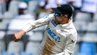 New Zealand's captain Tom Latham throws the ball during the third day of the third and final Test cricket match between India and New Zealand at the Wankhede Stadium in Mumbai on November 3, 2024. (Photo by INDRANIL MUKHERJEE / AFP)